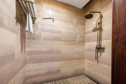 a bathroom with a shower with wooden walls at ChengDu Wuhou Temple Han Dynasty Hotel in Chengdu
