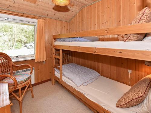 a bedroom with two bunk beds in a cabin at Secluded Retreat in Nature - By Traum Ferienwohnungen in Lønne Hede