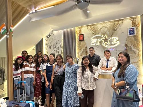a group of people standing around a counter in a store at Hotel Star Suites By Star Group in New Delhi