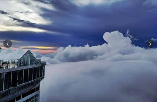 a view of the clouds from the top of a building at Highest Floor, Skyline Studio for 4Pax In Hoverland Genting Highlands in Genting Highlands