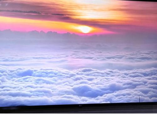 a view from above the clouds at sunset at Highest Floor, Skyline Studio for 4Pax In Hoverland Genting Highlands in Genting Highlands