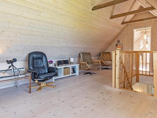 a room with a chair and a desk in a room at 10 person holiday home in Vinderup-By Traum in Vinderup