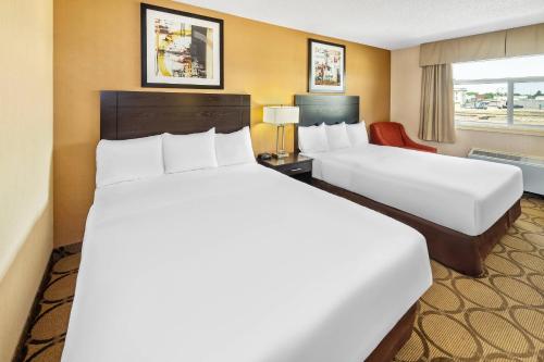 Un ou plusieurs lits dans un hébergement de l'établissement Econo Lodge