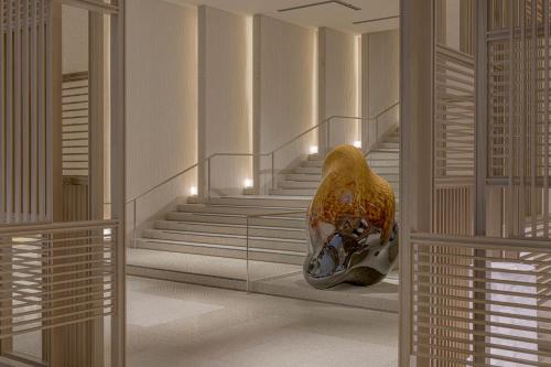 a hallway with a staircase with at Four Seasons Hotel Osaka in Osaka