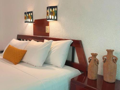 Un ou plusieurs lits dans un hébergement de l'établissement Hotel Maya Palenque