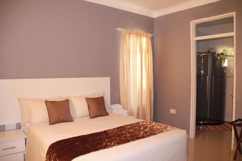 Ένα δωμάτιο στο Asante Apartments
