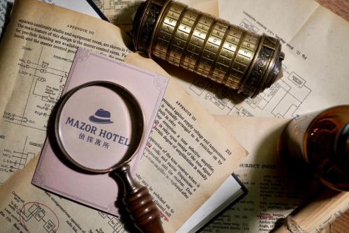 a magnifying glass sitting on top of a book at Mazor Hotel Hualien Linsen in Hualien City