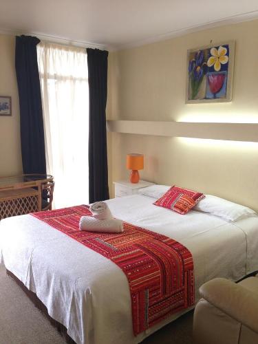 Ένα ή περισσότερα κρεβάτια σε δωμάτιο στο Abel Tasman Waterfront Motel