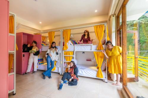 a group of people in a room with bunk beds at goSTOPS PLUS Kasol, Suma Ropa in Kasol