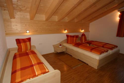 Una cama o camas en una habitación de Alpina Appartements