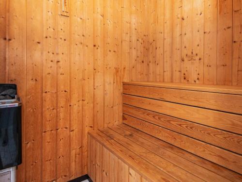 a wood paneled room with a sauna at Luxury Seaside Retreat - By Traum Ferienwohnungen in Fjand Gårde