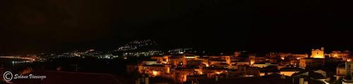 a view of a city at night with lights at Borgo 800 in San Nicola Arcella