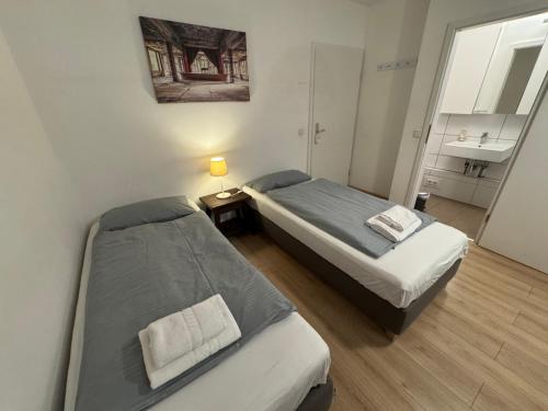 En eller flere senge i et værelse på Altstadtoase an der Marientormauer