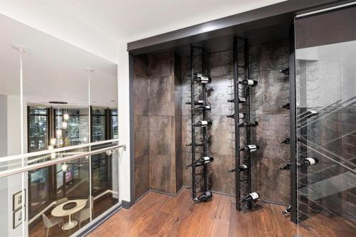 a walk in shower in a room with wooden floors at 3-Level Modern Luxury Sub-Penhouse, Best Ocean & City Views - Prime Downtown Location in Vancouver