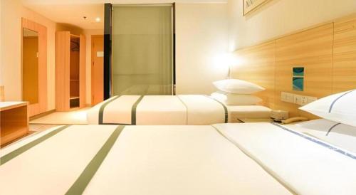 Letto o letti in una camera di City Comfort Inn Nanning Railway Station
