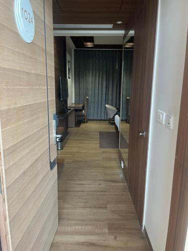 a hallway of an office with a desk and a room at Nirvana Grand Hotel & Resort in Gaya