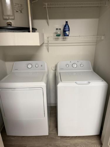 a white washer and dryer in a small kitchen at Mdelight Lodge in Frisco