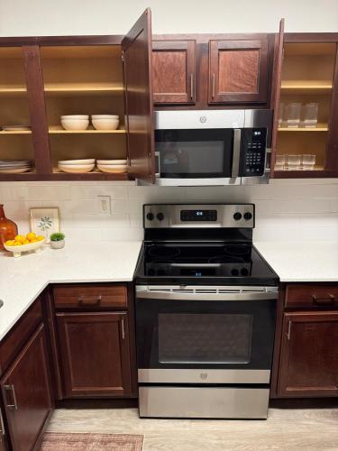 a kitchen with a stove and a microwave at Mdelight Lodge in Frisco