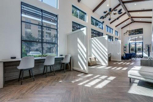 an office with chairs and a table and windows at Mdelight Lodge in Frisco