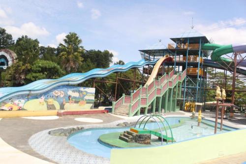 a water park with a slide and a water slide at Labersa Grand Hotel &Convention Center in Pekanbaru