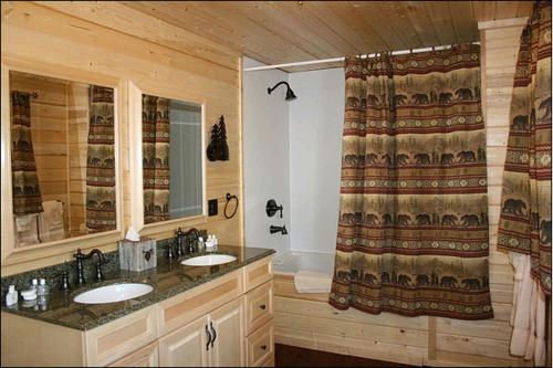 a bathroom with two sinks and a shower at St. Mary Village in Saint Mary