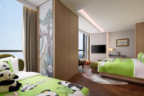 Jin Jiang International Hotel Mianyangにあるベッド