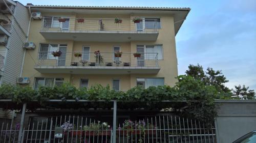 an apartment building with flowers on the balconies at House of Flowers in Ahtopol