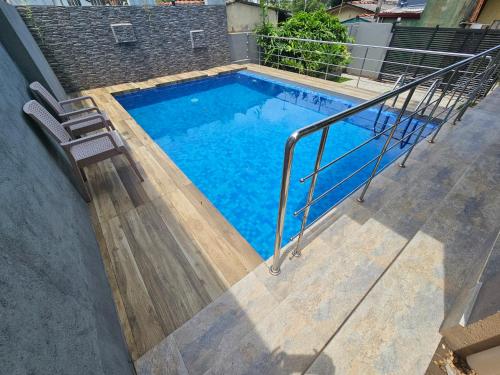 a swimming pool on the side of a building at Green Vibe Apartments in Nugegoda