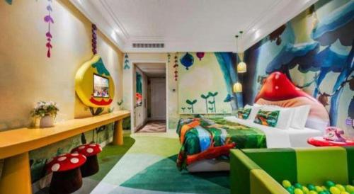 a childs room with a bedroom with a dinosaur themed bed at Hangzhou The First World Hotel in Hangzhou