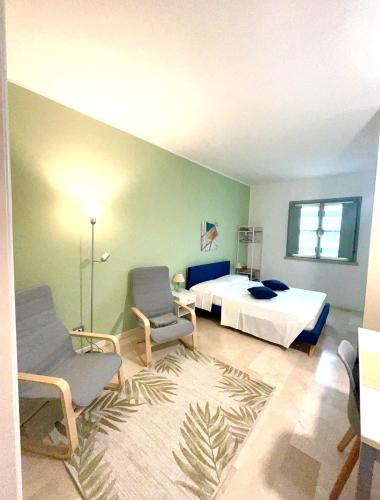 Ένα ή περισσότερα κρεβάτια σε δωμάτιο στο CASA MULINA SUITE- Centro storico