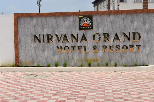 a sign for the nirvana grand hotel and resort at Nirvana Grand Hotel & Resort in Gaya