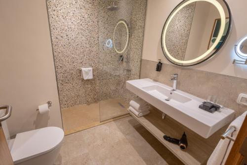 a bathroom with a sink and a mirror at The Kaktus Somabay in Hurghada
