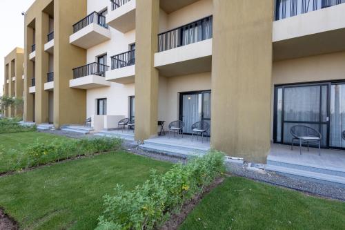 an exterior view of an apartment building at The Kaktus Somabay in Hurghada