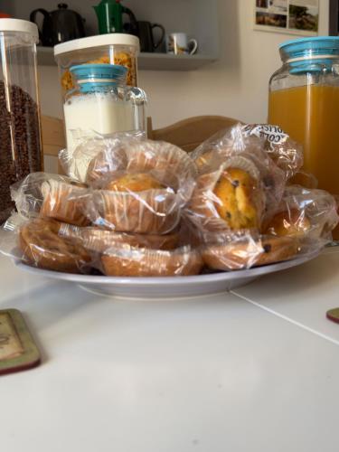 a plate of pastries in plastic bags on a counter at B&B Porta Verde in Castelbottaccio
