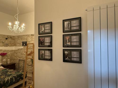 a room with four pictures on the wall at B&B Porta Verde in Castelbottaccio