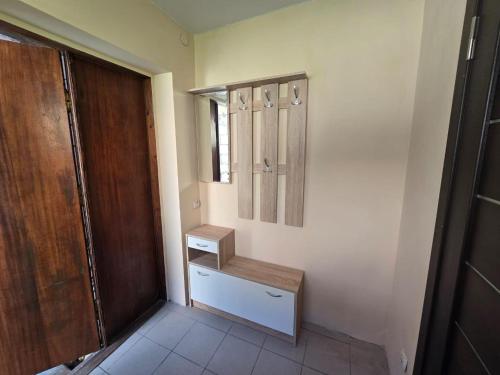 a room with a closet and a wooden door at Апартаменти CENTER in Uzhhorod