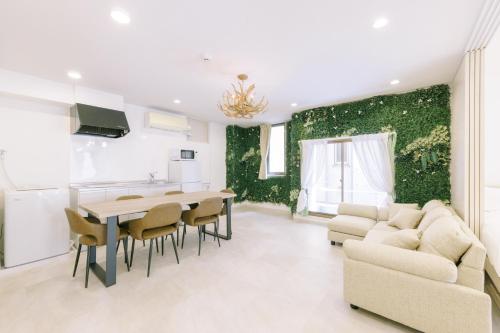 a kitchen and living room with a table and chairs at 8min walk from Shibuya Sta in Tokyo