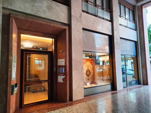 a facade of a building with a door and windows at Appartamento San Marco in Pordenone