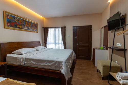 Postel nebo postele na pokoji v ubytování Jayagiri Guesthouse By Belgareti