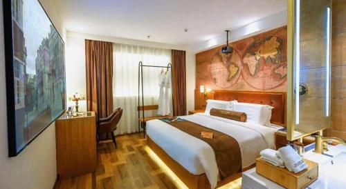 a hotel room with a large bed and a bathroom at James Joyce Coffetel Shenyang North Railway Station Qishan Road Metro Station in Shenyang