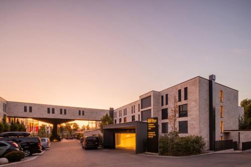 a rendering of a building with a parking lot at LMS - La Maison Suisse - Döttingen in Döttingen