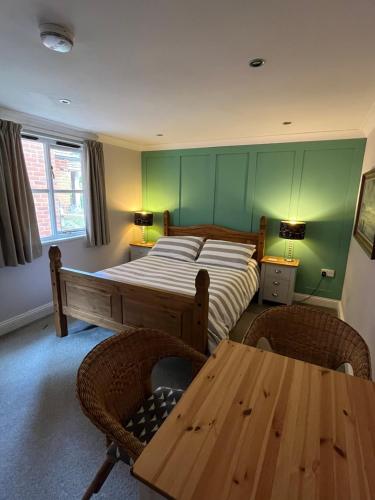 Postel nebo postele na pokoji v ubytování Mays Cottage Bed and Breakfast