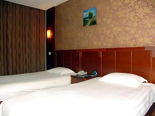 Letto o letti in una camera di GreenTree Inn Changshu South HaiYu Road Pedestrian Street Business Hotel