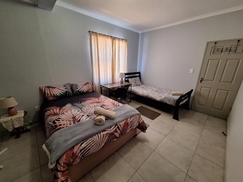Katil atau katil-katil dalam bilik di Huigu Homestay Accommodation