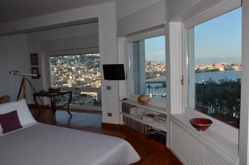 a bedroom with a bed and a window with a view at Suite 52 in Naples
