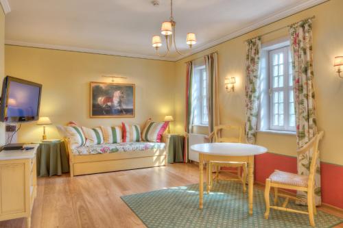 Posezení v ubytování Urlaubsresidenz Marstall und Kanzlei im Schlossensemble