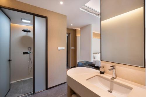 Ένα μπάνιο στο Leisure Haven (Tachuan) Hotel