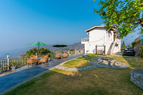 a house with a view of the mountains at Peace Stay 2BHK Villa in Bhīm Tāl