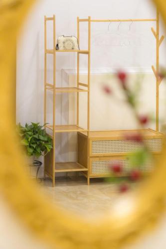 a shelf in a room with a plant on it at Danang's house in Da Nang