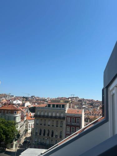 a view of a city from a window at Inspira Santos Boutique Hotel in Lisbon